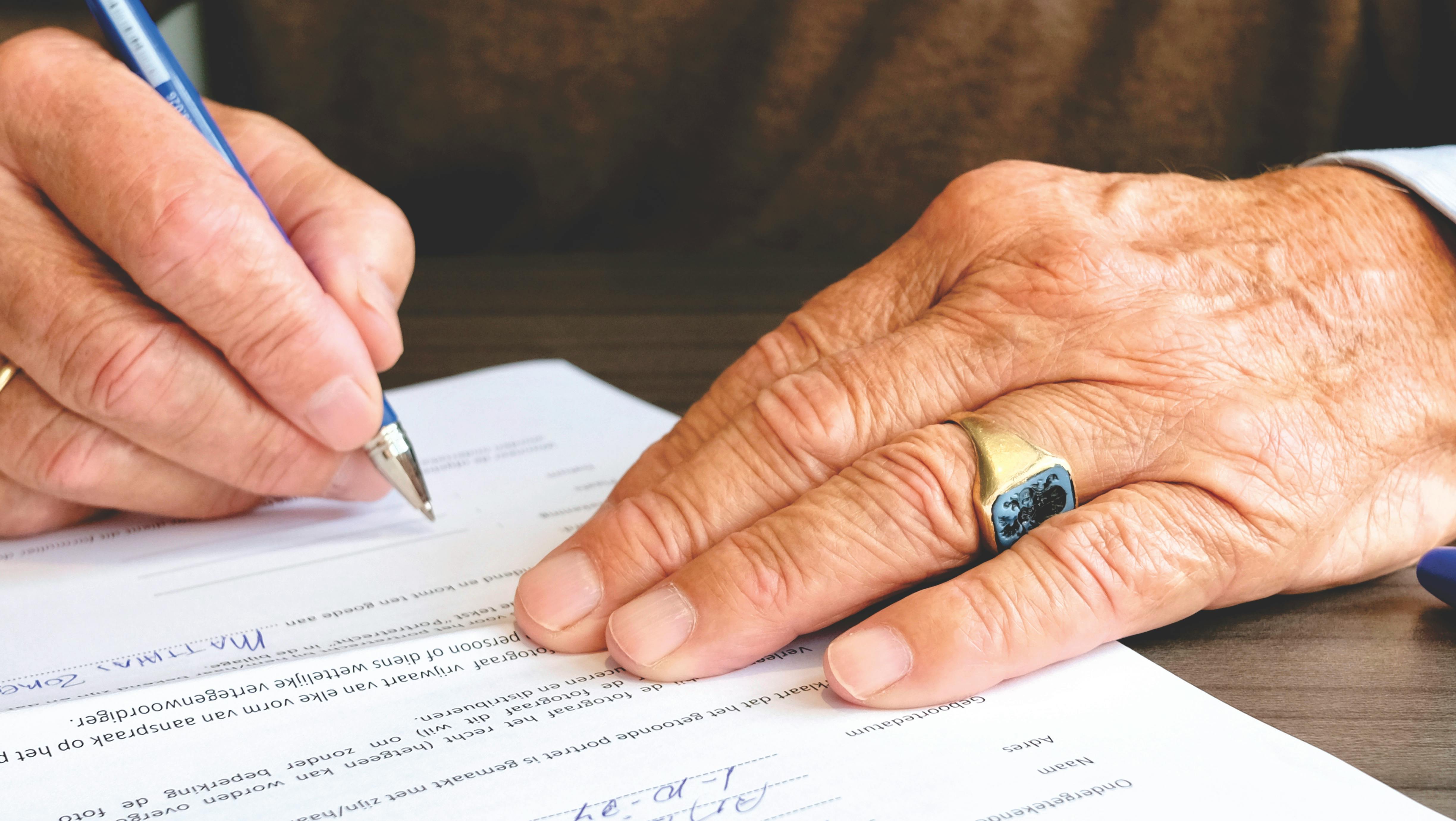 someone signing a contract
